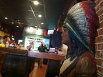 Photo of cigar store Indian at Melton's App & Tap.