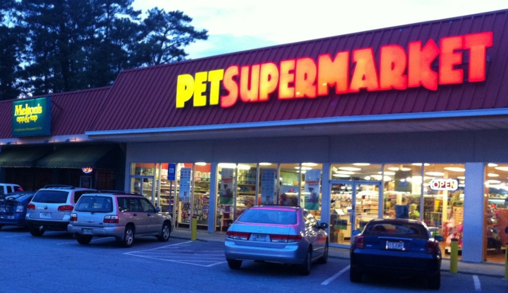 Photo of Melton's App & Tap's exterior next to Pet Supermarket