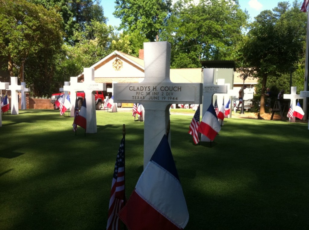 In David T. Maddlone's front yard near Emory University, styrofoam crosses and stars mark the losses of D-Day.