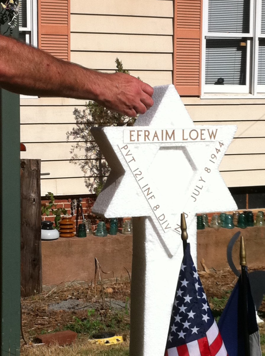 Maddlone observes a Jewish tradition of leaving pebbles to mark a grave. This one symbolizes the French gravesite of American soldier Efraim Loew, who was Jewish and died on D-Day, June 6, 1944.